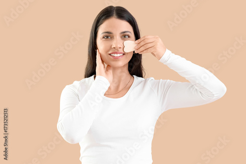 Young woman with gua sha ma...