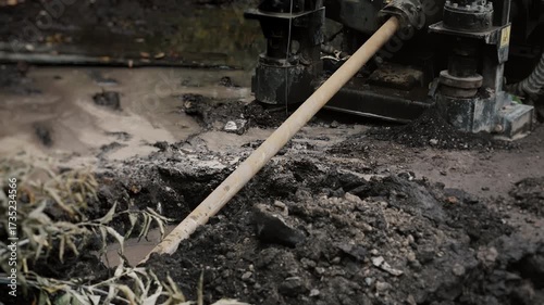 Wallpaper Mural Close-up of a drilling rod entering the ground at a construction site. Torontodigital.ca