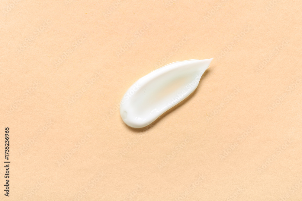 Obraz premium Sample of cosmetic cream on beige background