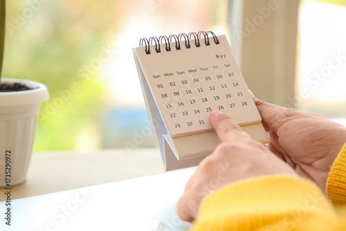 Female hands with flip cale...