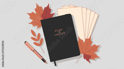 Autumnal flat lay featuring a black journal with plan create text a pen and fallen leaves on a neutral background