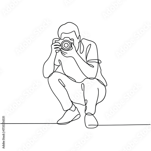 Artist s single line drawing of a photographer crouching with a camera