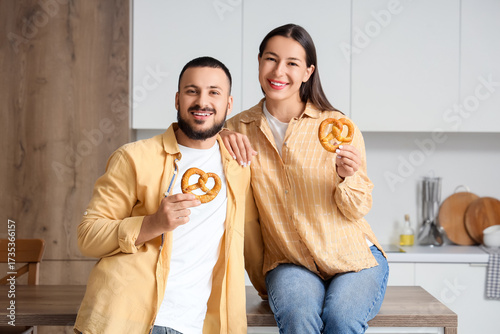 Young happy couple with tas...