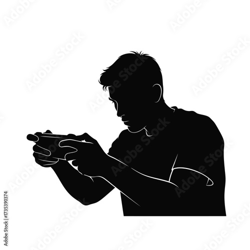 silhouette of a man playing a video game on his phone