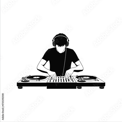 silhouette of a dj with headphones playing music on turntables