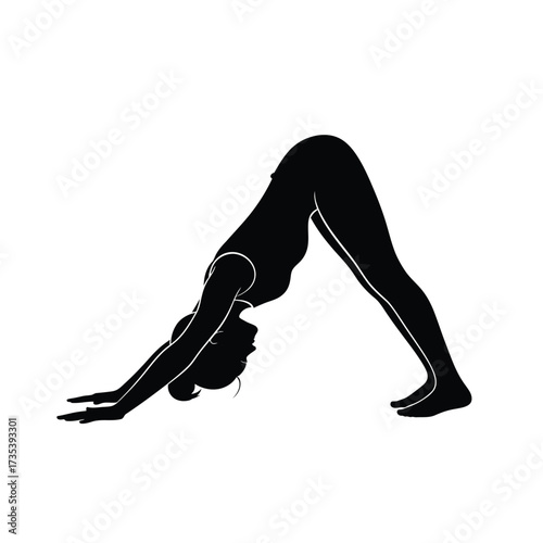 silhouette of a woman in yoga downward dog pose