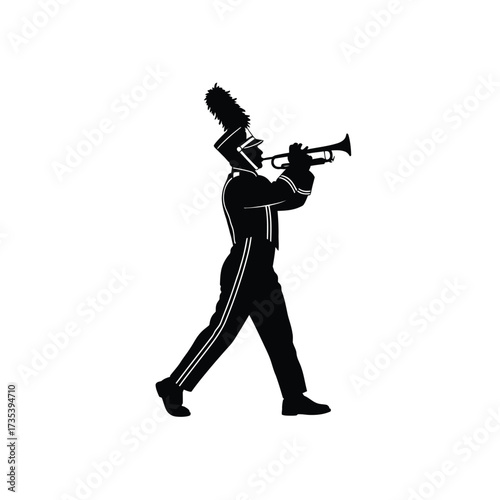 silhouette of a marching band member playing a trumpet