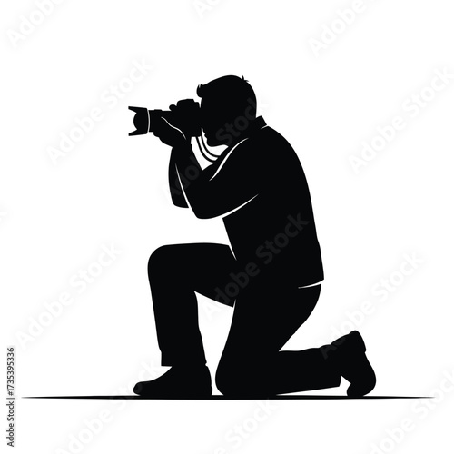 photographer kneeling with camera