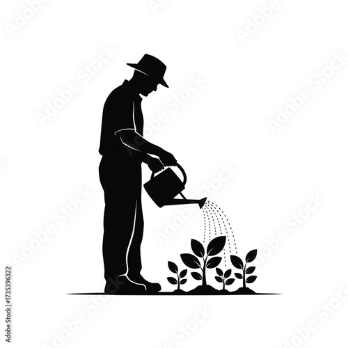 silhouette of a farmer watering plants