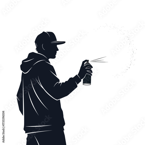 silhouette of a person spraying graffiti