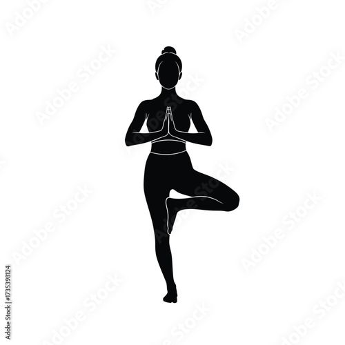 silhouette of a woman in yoga tree pose