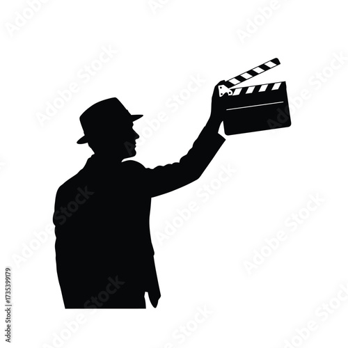 silhouette of a man in a hat holding a clapperboard