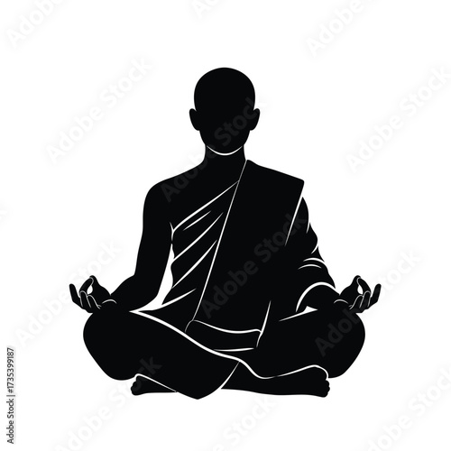 silhouette of a monk meditating in lotus pose