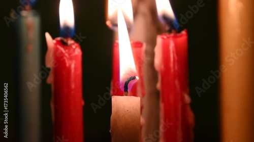 Candle flame close up on a dark background. Melted Wax Candle light border design. Burning at Night, Darkness. Candlelight.