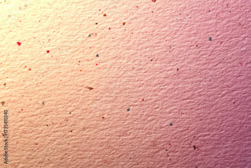 Textured paper with colorful specks creates vibrant background for art projects