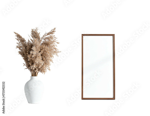 Dried floral arrangement beside tall framed mirror on black background