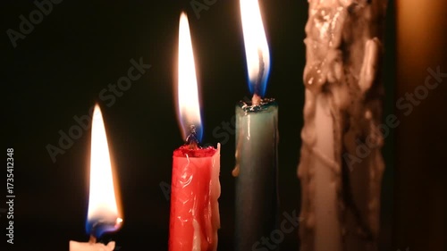 Candle flame close up on a dark background. Melted Wax Candle light border design. Burning at Night, Darkness. Candlelight.