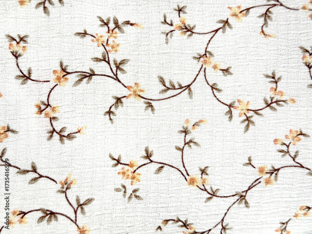 Close up graphic background of random floral, foliage, and swirls pattern with white cloth background. Seamless background texture.