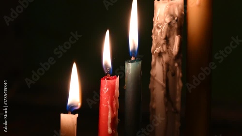 Candle flame close up on a dark background. Melted Wax Candle light border design. Burning at Night, Darkness. Candlelight.