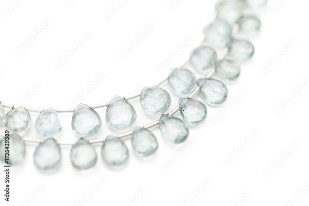 Obraz premium Moss Aquamarine Faceted Teardrop Gemstones on White