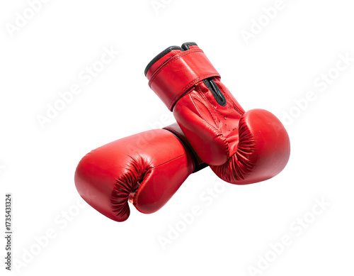 Two bright red leather boxing gloves, one over the other, against a black background