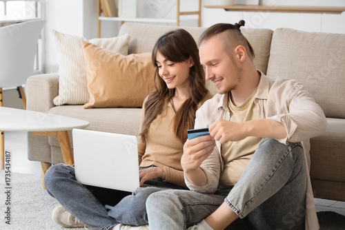 Young couple with credit ca...