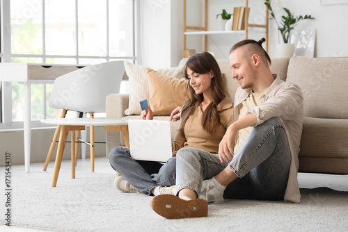 Young couple with credit ca...