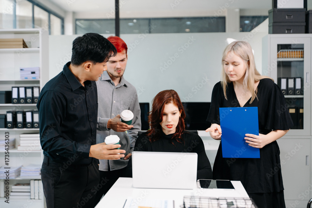 © Nuttapong punna - Office colleagues have a casual discussion. During a meeting in a conference room, a group of business teem sit in the conference room new startup project.