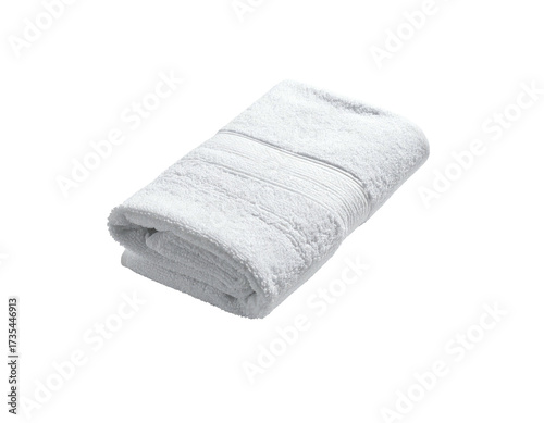 A folded, white, fluffy towel on a black background, with detailed texture