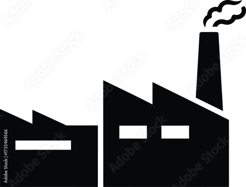 Black silhouette of a factory building with smoking chimney