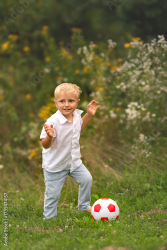 little boy playing with ball