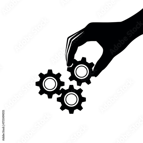 Hand placing a gear into a mechanism of interconnected gears