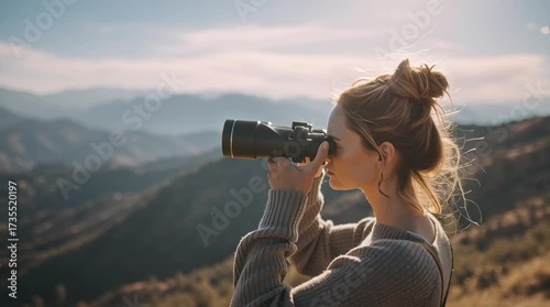 Venture into Discovery: A woman is focused, gazing through binoculars into the distance, exploring the horizon, standing on a serene mountain, a symbol of curiosity and exploration.