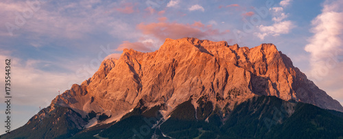 Photography Zugspitze massif glowing in warm alpenglow at sunset, Bavarian Alps, Germany