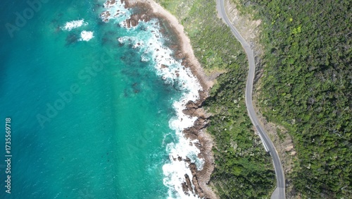 Coastal road on the beautiful ocean coast of Australia. Blue sea and wild coast view from above.