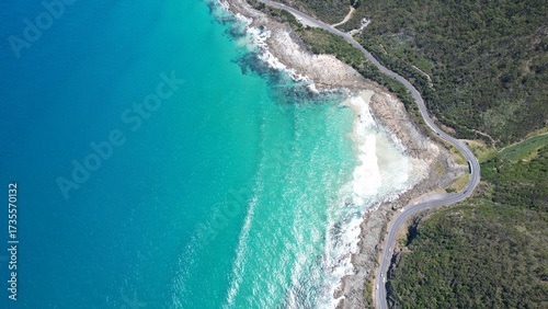 Coastal road on the beautiful ocean coast of Australia. Blue sea and beautiful beaches view from above.
