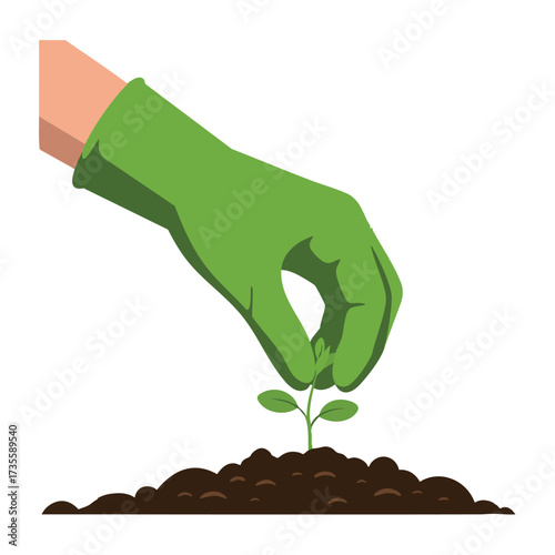 Hand wearing green glove planting a small seedling in dark soil.