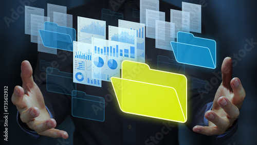 Document management system DMS and automated repository technology. Business person holding documents and folder icons.