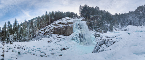 Frozen waterfall in winter landscape near Krimml, Austrian Alps