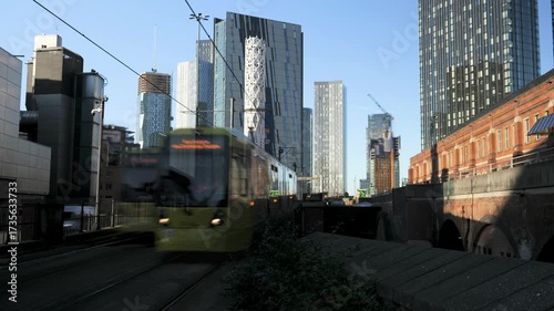 4K: Timelapse of Metro Trams in Manchester, England, UK. Skyscrapers behind. Stock Video Clip Footage