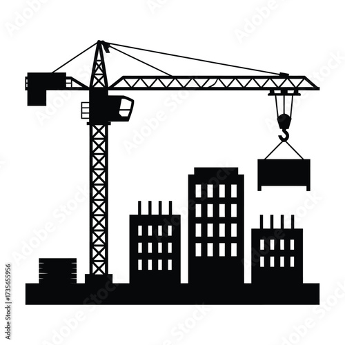 Silhouette of a construction crane lifting a load over buildings