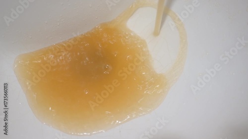 Dirty rusty water flows from the tap.
