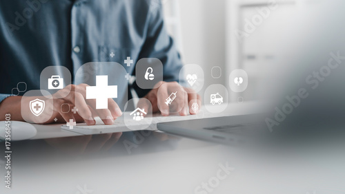Medical service and Health Insurance business, Doctor using laptop computer with health care icons, medical technology background,  telemedicine, virtual hospital, family medicine concept