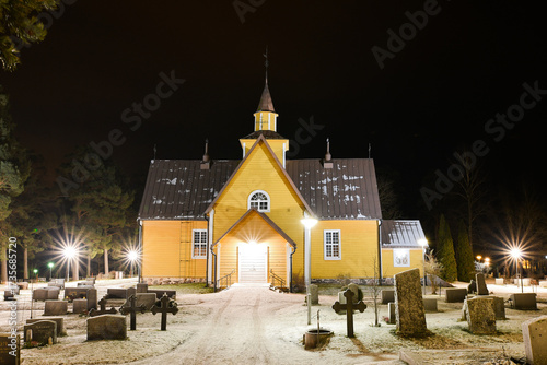 Old wooden church at night in Finland