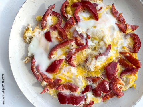 Scrambled Egg with fresh Red Bell Pepper on Plate for breakfast