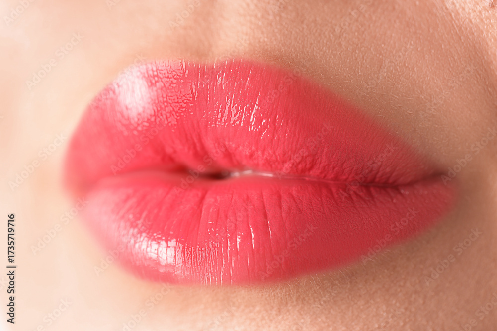 Fototapeta premium Woman with beautiful lipstick on her lips, macro view