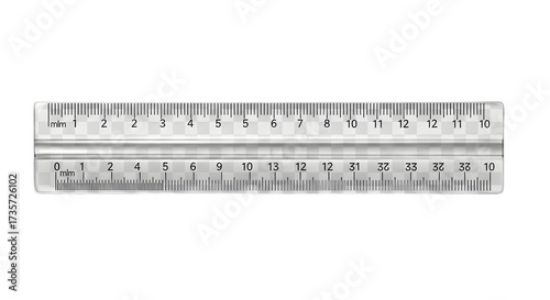 Close up of a clear plastic ruler with black markings on a black background