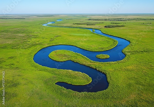 Winding river through a grassy plain