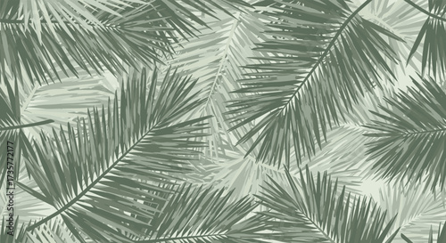 A close up view of overlapping green palm leaves creating a natural tropical pattern.