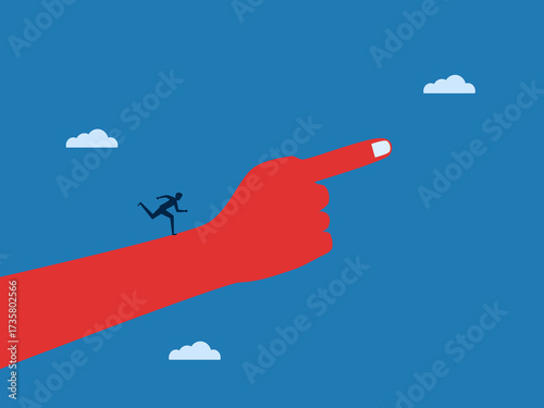Businessman running on giant hand pointing the way